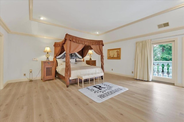 bedroom featuring ornamental molding and light hardwood / wood-style floors