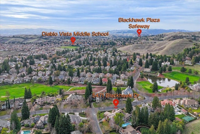 bird's eye view featuring a water and mountain view