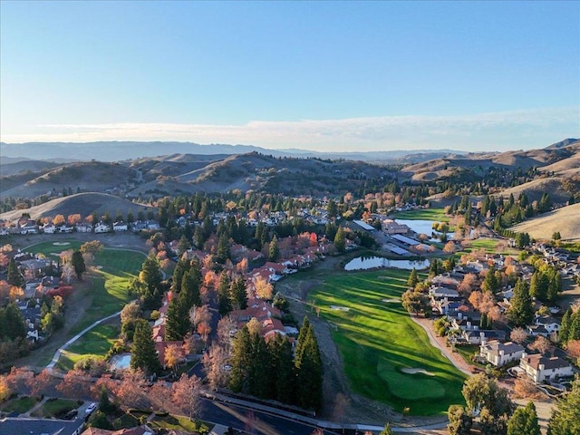 birds eye view of property featuring a water and mountain view