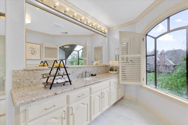 bathroom with decorative backsplash, plenty of natural light, and crown molding