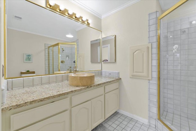 bathroom featuring a shower with shower door, vanity, ornamental molding, and tile patterned flooring