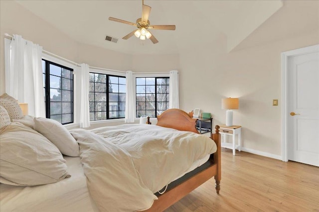 bedroom with ceiling fan and light hardwood / wood-style flooring