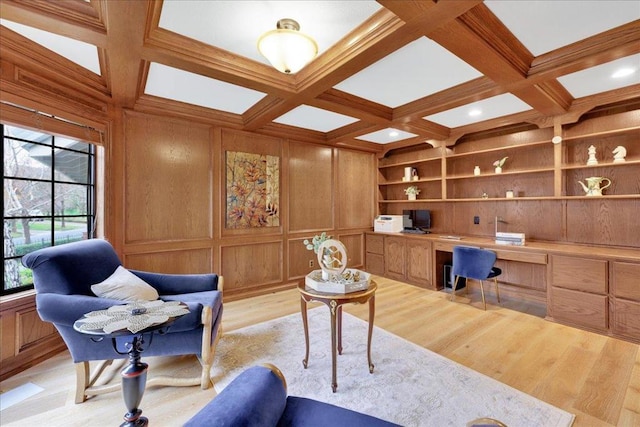 office featuring built in desk, built in features, wood walls, and coffered ceiling