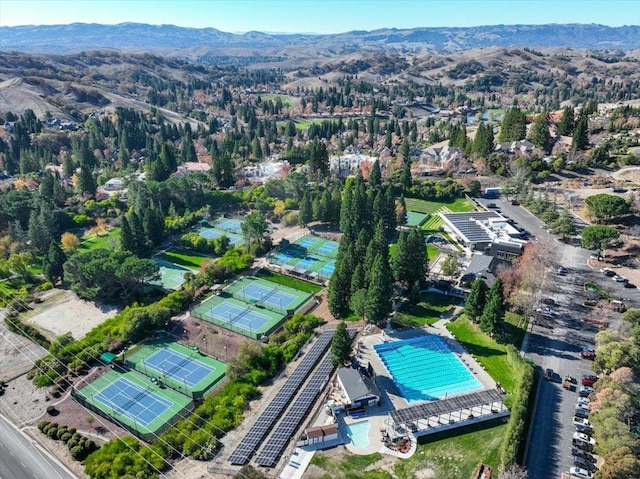 birds eye view of property with a mountain view