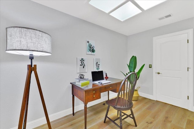 office area with wood-type flooring