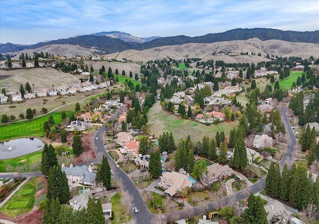 bird's eye view with a water and mountain view