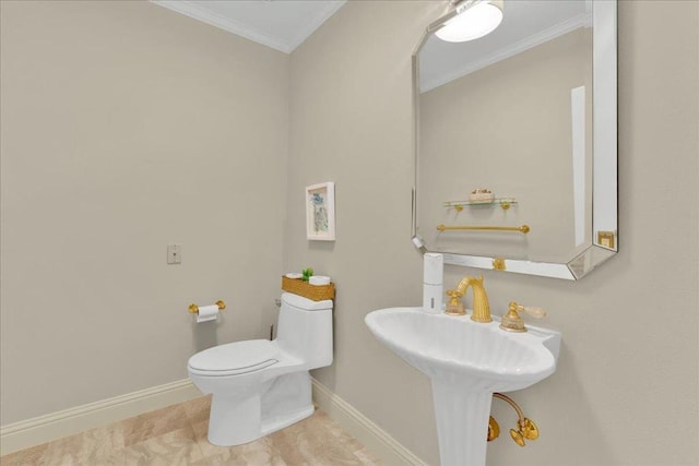 bathroom with toilet and ornamental molding