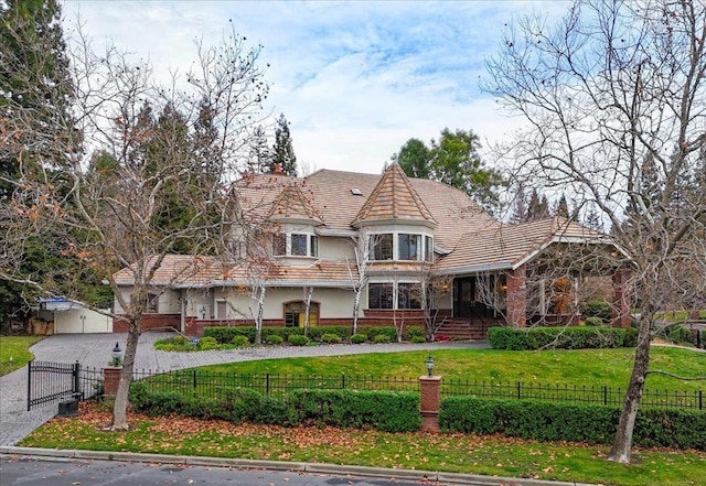 victorian home with a front lawn