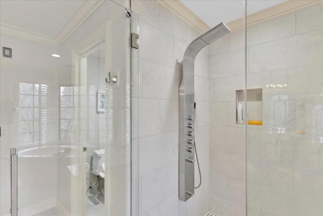 bathroom with a shower with door and ornamental molding