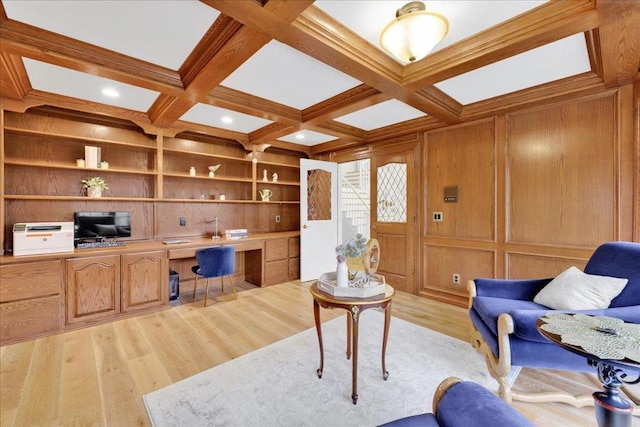 office area featuring wood walls, built in desk, beamed ceiling, coffered ceiling, and built in features