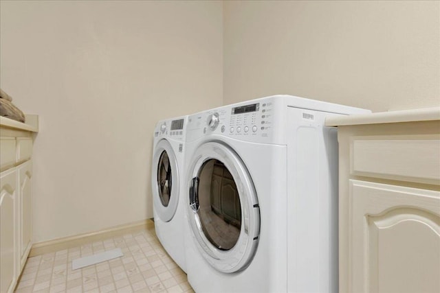 washroom with independent washer and dryer