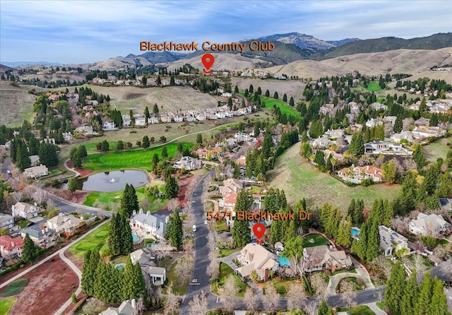 birds eye view of property featuring a water and mountain view