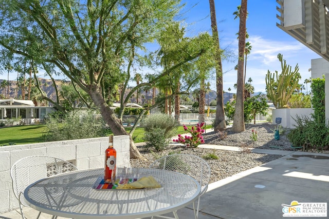 view of patio / terrace with a mountain view