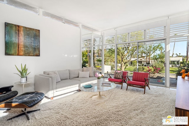 living room with expansive windows and a wealth of natural light