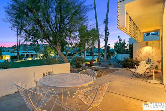 view of patio terrace at dusk