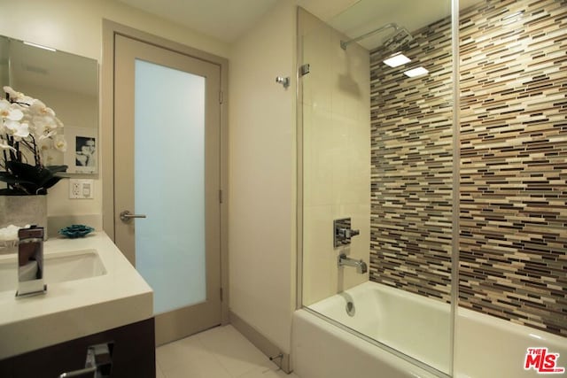 bathroom with tile patterned flooring, vanity, and enclosed tub / shower combo