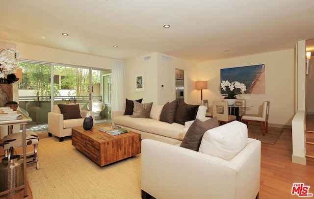 living room with light hardwood / wood-style floors