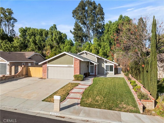 ranch-style home featuring a front yard and a garage