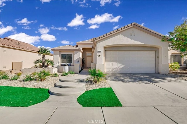 mediterranean / spanish-style home featuring a garage