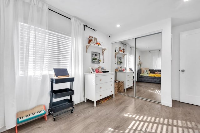 bedroom featuring a closet and light hardwood / wood-style flooring