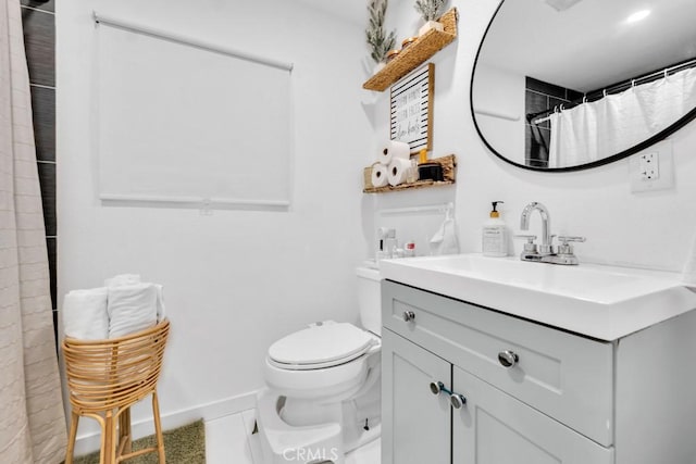 bathroom with toilet, tile patterned flooring, vanity, and curtained shower