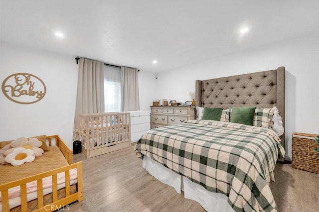 bedroom with light hardwood / wood-style flooring