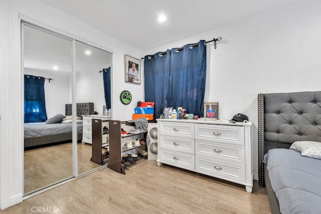 bedroom featuring a closet and light hardwood / wood-style flooring