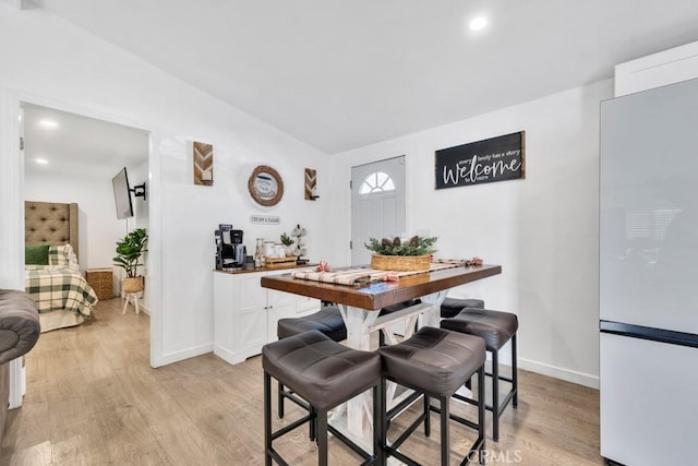 dining area with light wood-type flooring