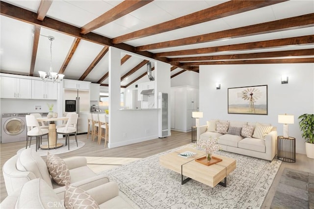 living room featuring a chandelier, washer / dryer, vaulted ceiling with beams, and light hardwood / wood-style floors