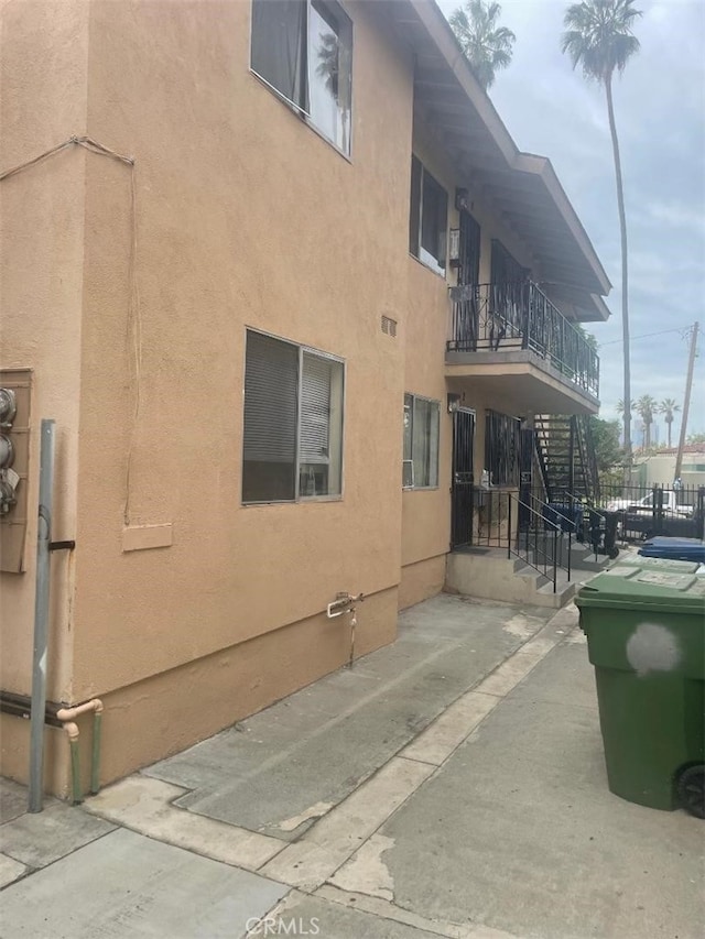 view of side of home with a patio area