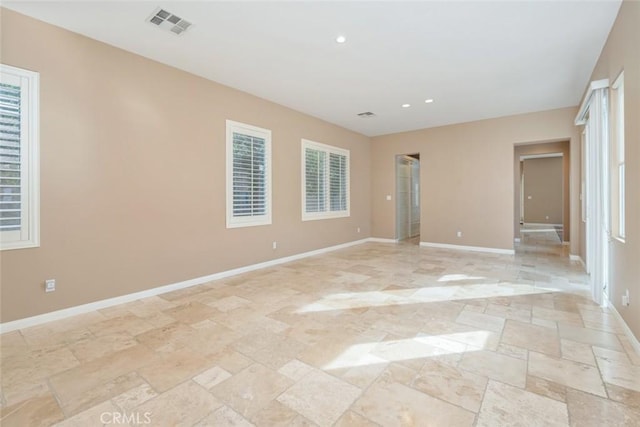 unfurnished bedroom featuring multiple windows