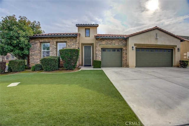 mediterranean / spanish-style home with a garage and a front lawn