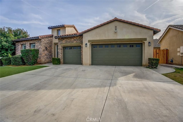 mediterranean / spanish house featuring a garage