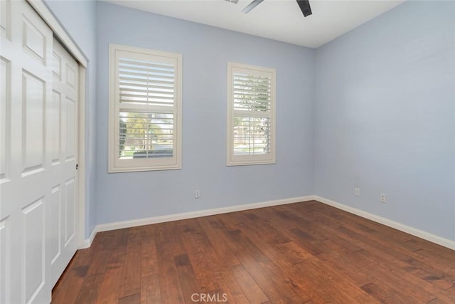 unfurnished bedroom featuring wood-type flooring, a closet, and ceiling fan