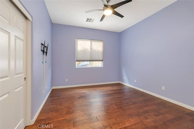 unfurnished room featuring ceiling fan and dark hardwood / wood-style flooring