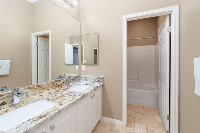 bathroom featuring vanity and shower / bath combination