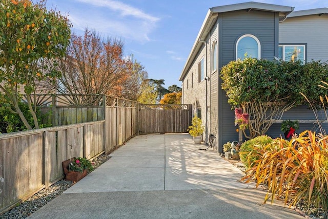 view of property exterior with a patio