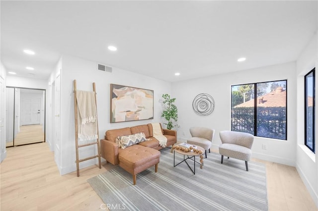 living area with light hardwood / wood-style floors