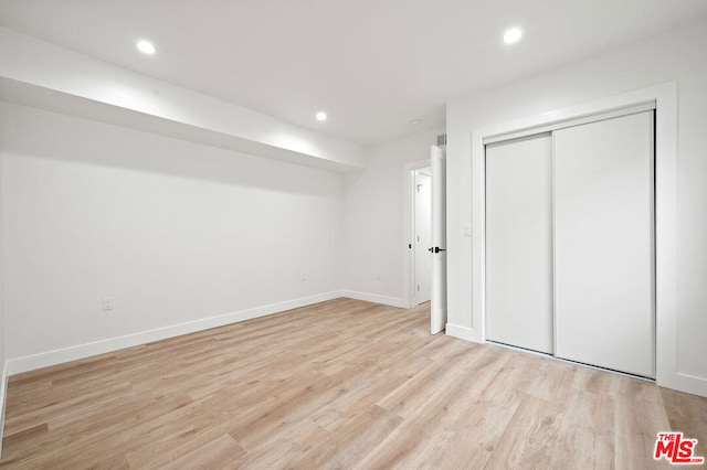 basement featuring light hardwood / wood-style floors