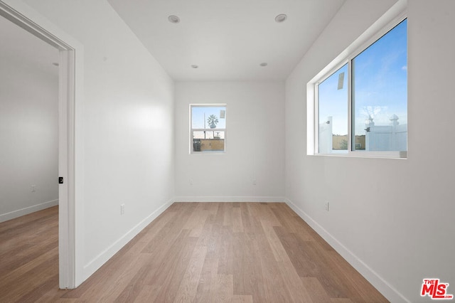 unfurnished room with light hardwood / wood-style flooring