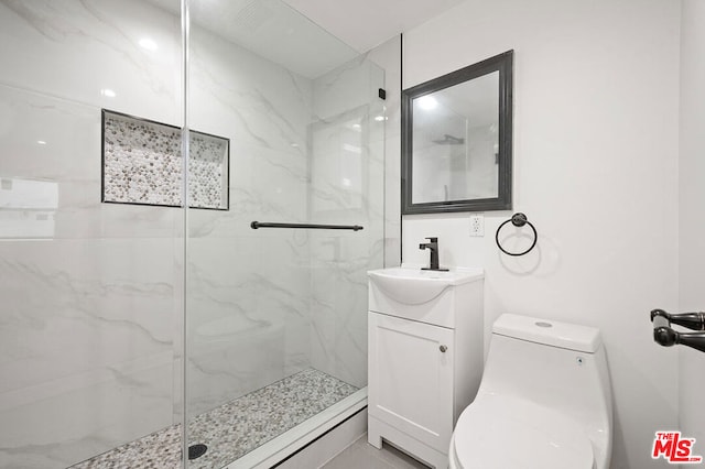 bathroom with vanity, toilet, and walk in shower