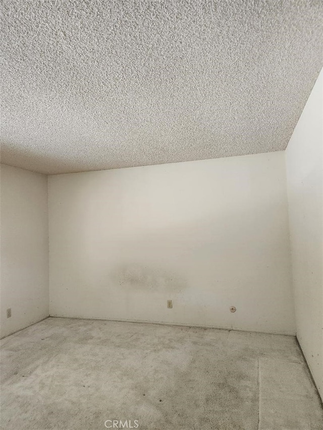 empty room with a textured ceiling