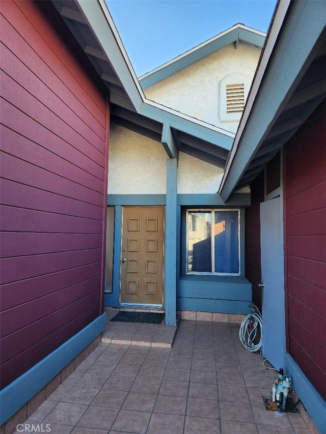 entrance to property with a patio