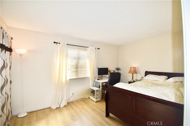 bedroom with light hardwood / wood-style floors