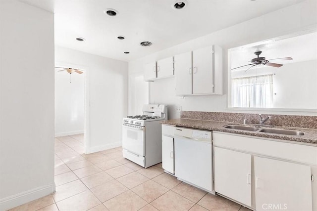 kitchen featuring ceiling fan, sink, light tile patterned floors, white appliances, and white cabinets