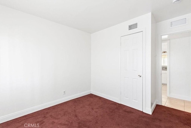 unfurnished room with carpet floors