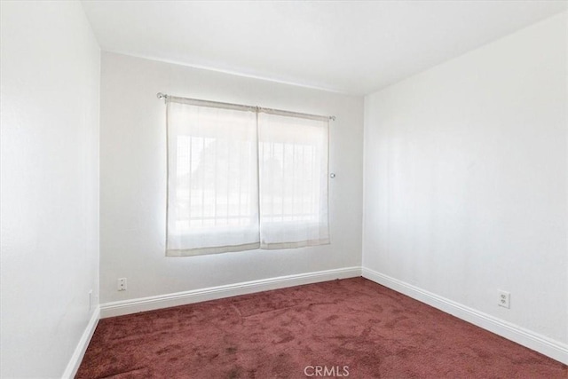 empty room with carpet flooring