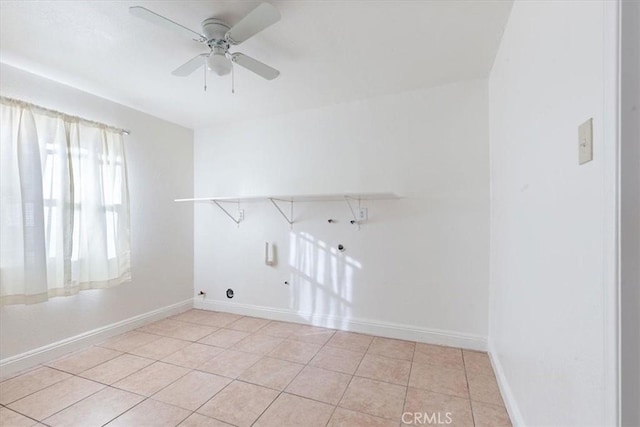 clothes washing area with washer hookup, ceiling fan, and light tile patterned floors