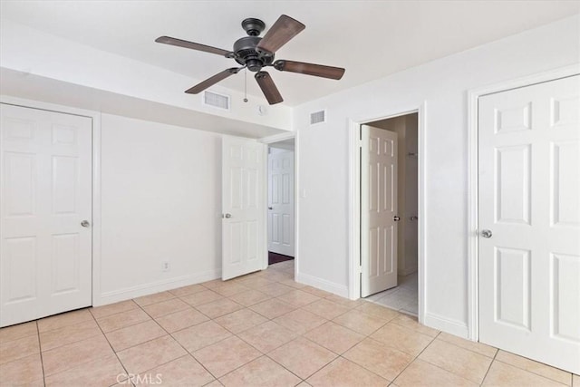 unfurnished bedroom with ceiling fan and light tile patterned flooring