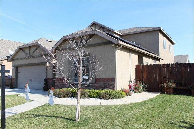 view of side of home featuring a yard and a garage